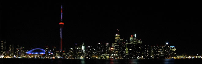 The Toronto skyline at night as seen from Toronto Island.