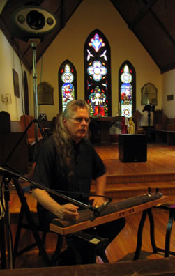 Randy Raine-Reusch performs at St. Andrew-by-the-Lake